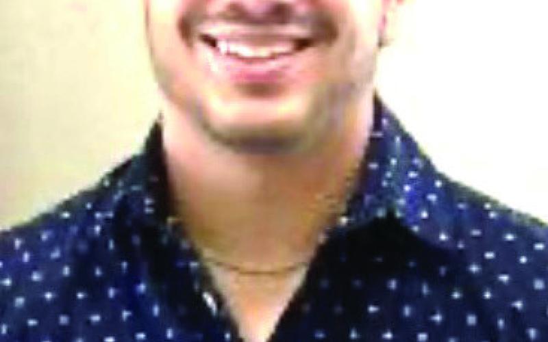 Young coach Bozeman brings energy to Garden City