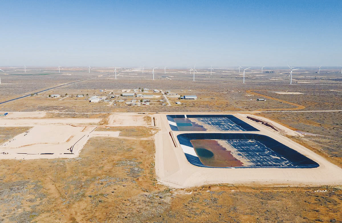 An aerial photo from 2024 shows oilfield wastewater water ponds constructed next to Circle 6 Baptist Camp near Stanton. State regulators approved the facility despite concerns from residents and camp leadership about potential impacts on water and air quality. Now, residents are raising similar concerns over another proposed wastewater facility near homes in Lenorah, about 10 miles east of the Circle 6 site. Photo credit: Julian Mancha for The Texas Tribune/Inside Climate News