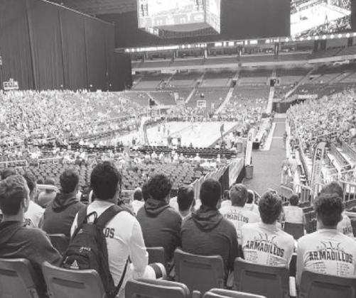 The San Saba boys basketball team watches the UIL State Basketball Tournament in the Alamodome in San Antonio on March 12. The Armadillos were scheduled to play March 13, but after four games were played on Thursday, the UIL suspended the contest until further notice due to concerns over COVID-19. (by San Saba ISD)