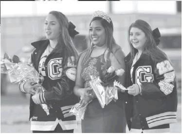 RIGHT: Returning to crown the new queen was 2018 Homecoming Queen Jaden Rodriguez. Assisting her were Grady cheerleaders Sydney Gonzales and Sage McAnally.