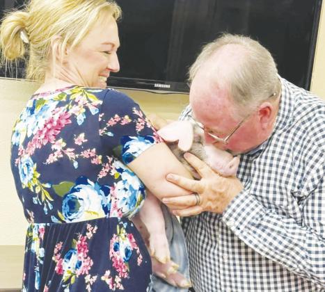 The First Methodist Church in Stanton hosted a fundraiser for its youth. The person with the most money donated in their name would be the winner and have to kiss a pig. Rickey Fleckenstein was the lucky winner.