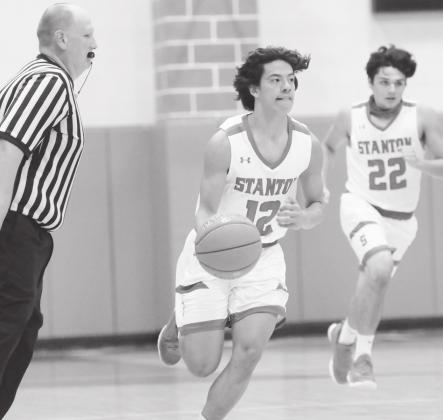 Stanton guard Nickoli Aguirre keeps his eyes up court looking for an open teammate.