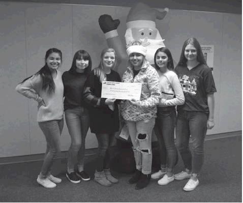 Stanton Student Council President Shelby Phillips presents Mrs. Kim Juarez of the Martin County Community Fund with a check for $334 on Wednesday. Also pictured: Vice President Aubrey Cantu, Secretary Emilee Day, Sergeant-at-Arms Alyssa Almaguer, and Treasurer Karina Bustillos.