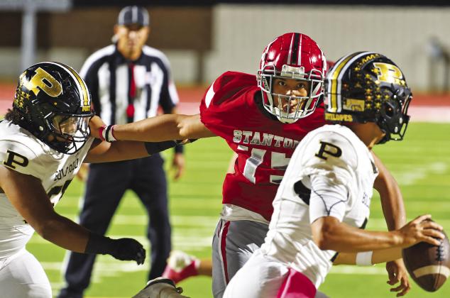 Stanton defensive lineman Marcus Glover looks to sack to Post quarterback earlier this his. Glover will look to pressure Grape Creek this Friday in Stanton as the Buffaloes try to stay at the top of the district standings.