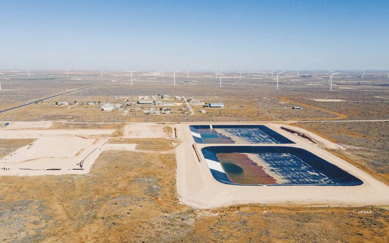 An aerial photo from 2024 shows oilfield wastewater water ponds constructed next to Circle 6 Baptist Camp near Stanton. State regulators approved the facility despite concerns from residents and camp leadership about potential impacts on water and air quality. Now, residents are raising similar concerns over another proposed wastewater facility near homes in Lenorah, about 10 miles east of the Circle 6 site. Photo credit: Julian Mancha for The Texas Tribune/Inside Climate News