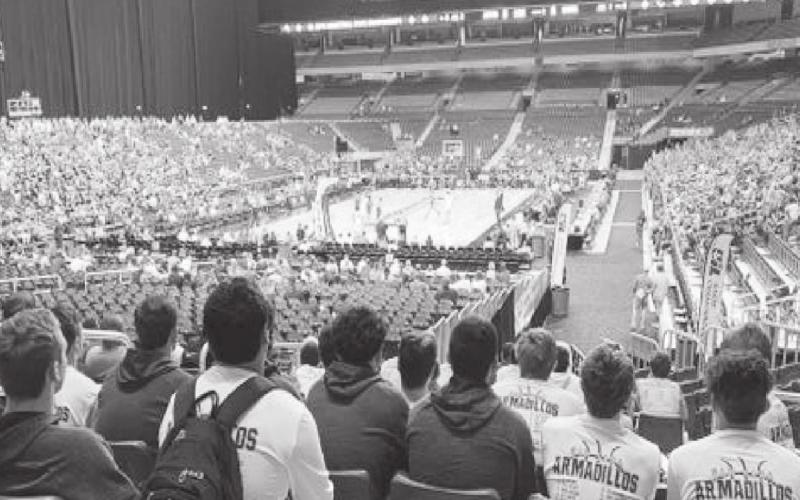 The San Saba boys basketball team watches the UIL State Basketball Tournament in the Alamodome in San Antonio on March 12. The Armadillos were scheduled to play March 13, but after four games were played on Thursday, the UIL suspended the contest until further notice due to concerns over COVID-19. (by San Saba ISD)