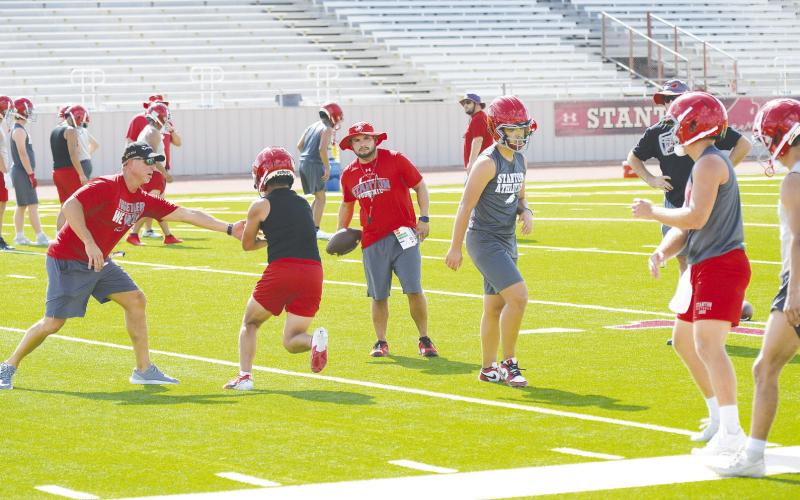 The Stanton Buffaloes were on the field Monday afternoon for the first practices of the 2024 season. First year head coach Gary Griffin and coach Estevan Chavez work with the quarterbacks and running backs on hand offs.