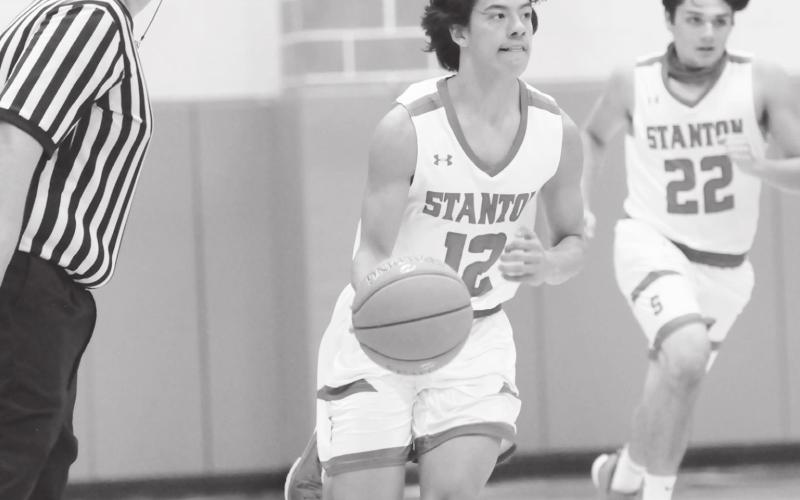 Stanton guard Nickoli Aguirre keeps his eyes up court looking for an open teammate.