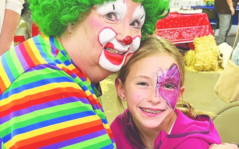 Greenie the Clown was at the soup cook off this weekend entertaining the kids with face painting. One of her favorites was a pink butterfly painted on Evelyn Haile.