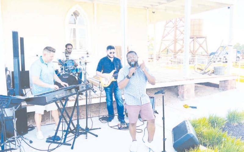 Albert Hall serenaded the crowd at the 1884 Plaza during the Farmet Market on Tuesday.