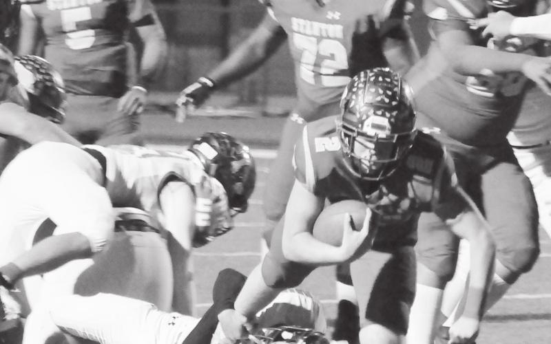 Evan Cox carries the ball for the Buffaloes offense during district action earlier this season.