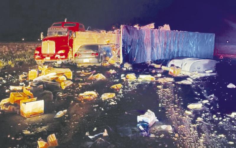 After two semis collided on Hwy 349 and CR 5100 and made a massive mess, another car drove through the debris. There were no injuries reported.
