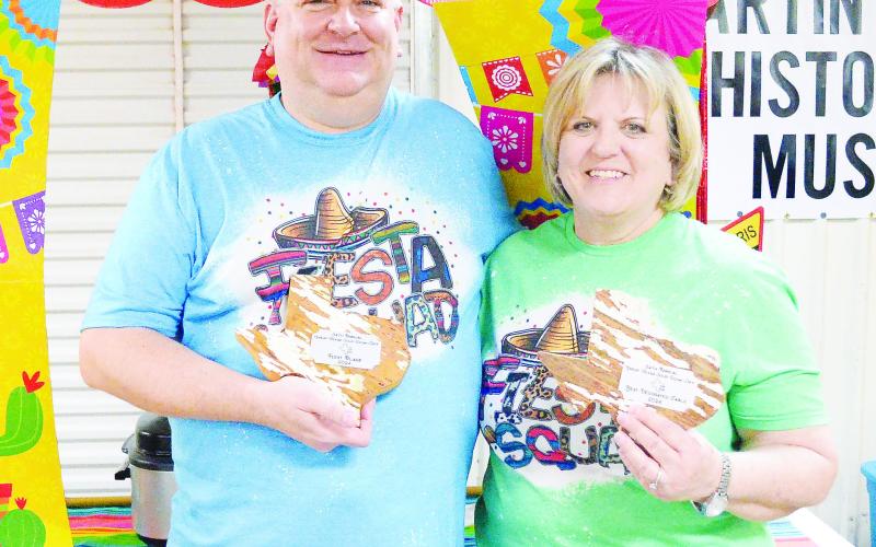 Brent Swink and Sally Poteet proudly hold up their plaques for First Place Soup and Best Decorated Table from the 34th Annual Great Texas Soup Cook-off.