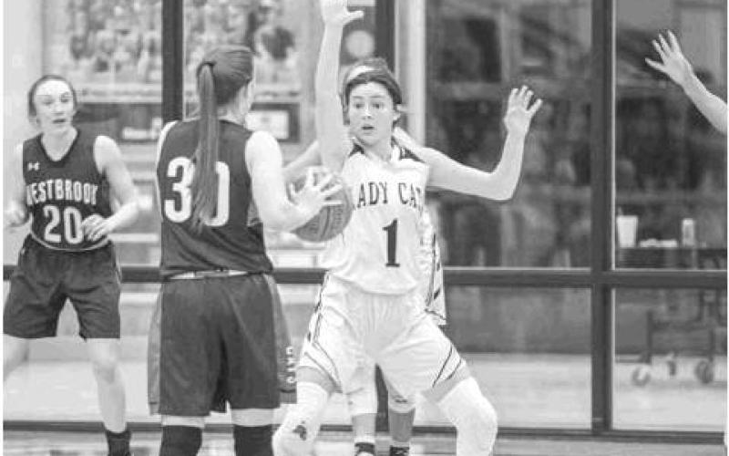 Maddy Garza plays defense at the top of the key against Westbrook.