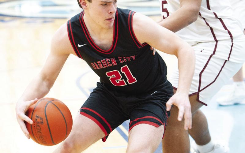 Garden City center Preston Dehlinger (21) attacks the basket during the Bearkat’s Area Championship win over Rankin last Friday at Greenwood High School.