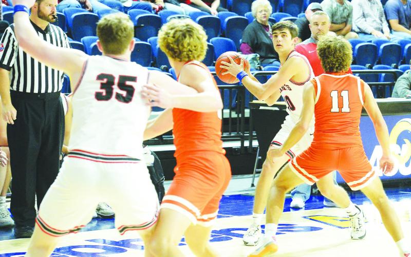 Garden City’s Levi Easterling (10) looks to pass the ball to teammate Jarett Fryar (35) during the Class A Regional Quarter-Finals against Robert Lee at the Junell Center in San Angelo on Tuesday.