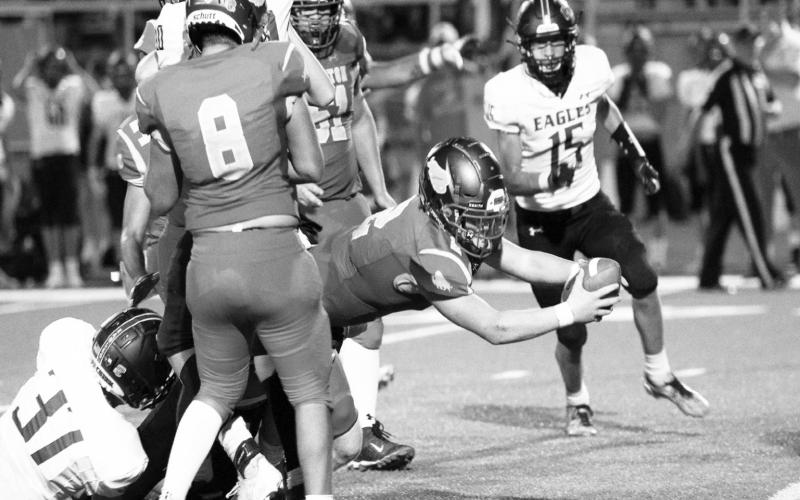 Stanton running back Evan Cox fights for every inch in the Buffs Friday night season opening victory over Grape Creek.