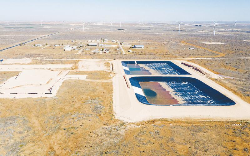 Produced water ponds, constructed by Martin Water, and Circle 6 Baptist Camp, top, in Lenorah on Feb. 24, 2024. The Railroad Commission approved the construction of the ponds, used to treat and recycle produced water from fracking, next to the Circle 6 Baptist Camp in the Permian Basin. Credit: Julian Mancha for The Texas Tribune/Inside Climate News