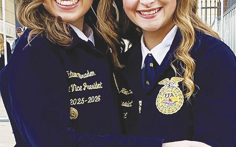 Garden City senior Tatum Braden, left, poses with a fellow FFA member at the National FFA Convention &amp;amp; Expo in Indianapolis.