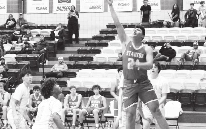 Alex Flores drops in two points during Bi-District Tuesday night against San Angelo TLCA.