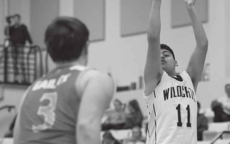 Grady's Gunnar Rivas knocks down a jumper during district action in Grady last week.