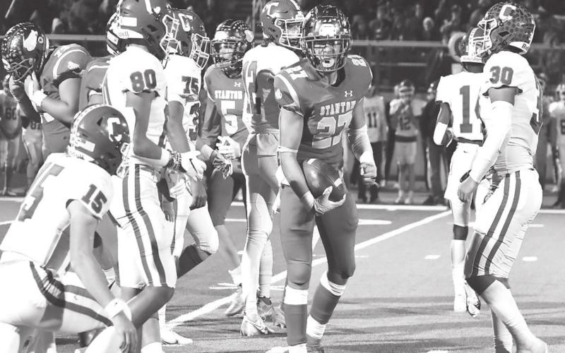 Stanton running back Ryan Andler flexes after picking up a big first down during Stanton’s stunning 39-34 bi-district victory over No. 3 Childress last Thursday in by Neeley Poitevint Floydada.