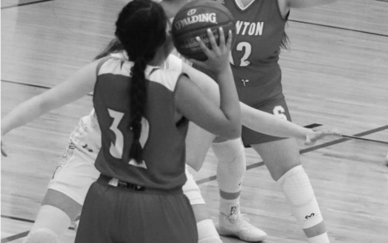 Zoey Ruiz looks to drop a pass into Hailea Vera Cruz during the Lady Buffs final district game of the season against Jim Ned.