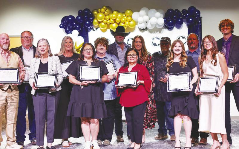 This year’s award recipients pose for a photo after being recognized at the Martin County Chamber banquet March 23.