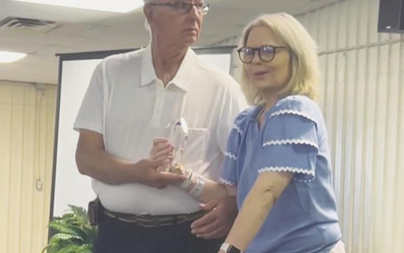 Dana Lauderdale, daughter of Danny Fryar, walked up to present her Dad the “Lifetime Achievement” award at the Chamber Banquet.