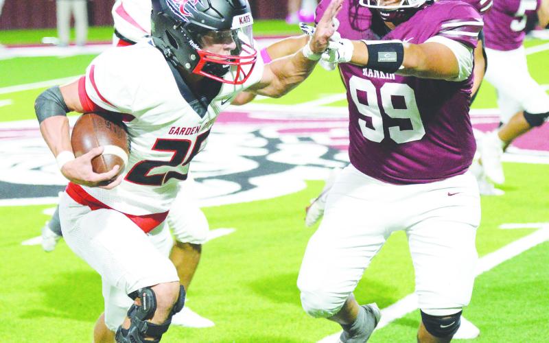 Brody Walts throws a stiff arm during a kickoff return for a touchdown during the Bearkats game against Rankin on Oct. 11.