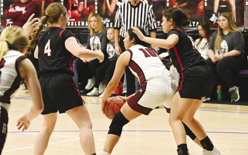 Garden City’s Ivy Braden (4) and Jasmine Nunez (12) didn’t let Rankin’s offense breathe during the Lady Kats Area Championship victory last Friday at Midland Christian.