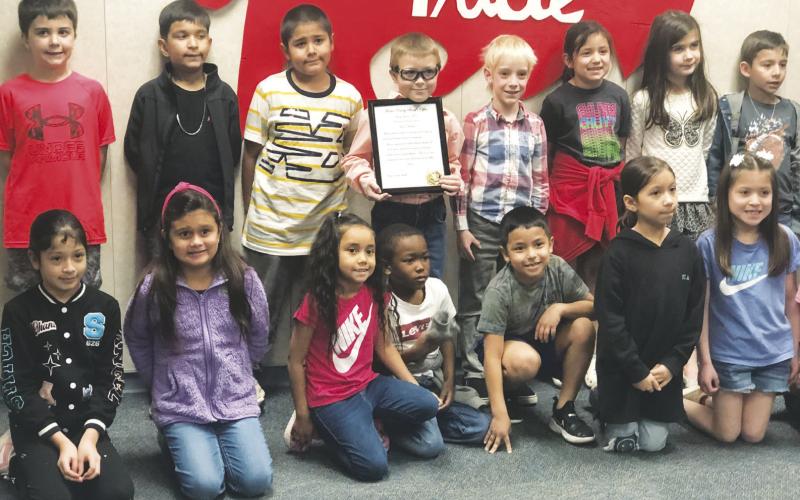 Stanton first grader Mason Belcher is pictured with his class mates after receiving an award from the Martin County Sheriff’s Office for bravery. See story this page.