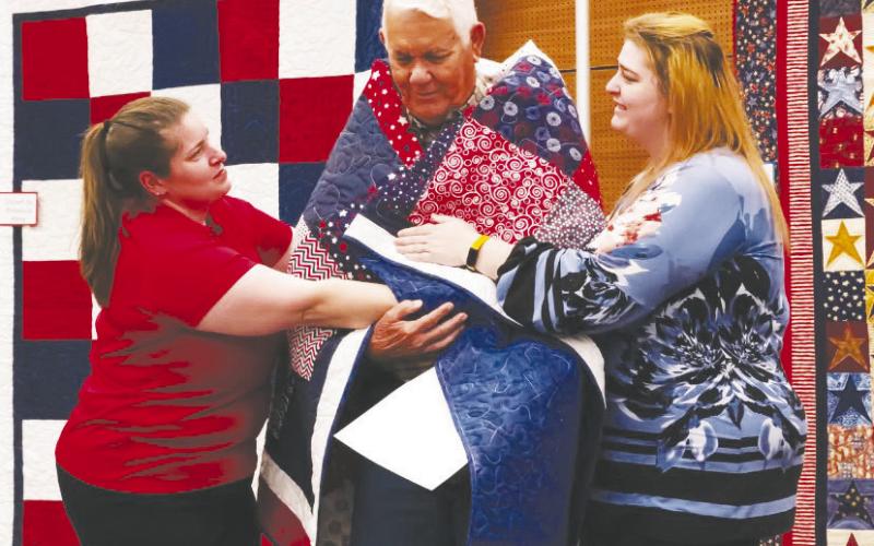 Bill Swink was wrapped in love this past weekend as he received his Quilt of Valor, a handmade quilt awarded to a service member or veteran to say, “Thank you for your service and sacrifice.”