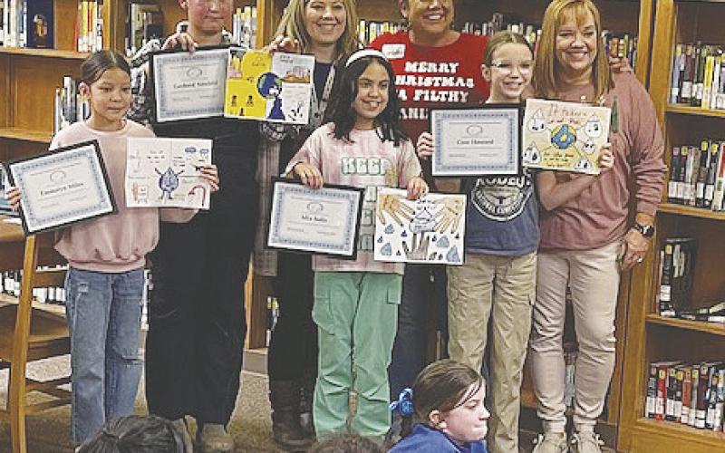 Sands Winners. Left to Right: Emmalyn Miles (4th Grade), Gerherd Neufeld (5th Grade), Shylo Mitchell (4th Grade Teacher), Mia Solis (5th Grade), Brianna Allred (PBUWCD Education Coordinator), Cree Howard (5th Grade) and Michele Stinson (5th Grade Teacher)