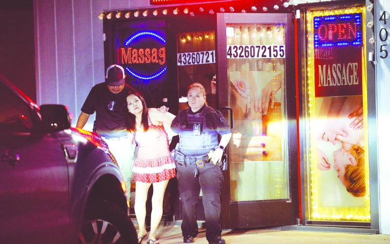 Officers with the Stanton Police Department arrest Guijie Han for prostituion at her place of business on Apr. 30 in Stanton.