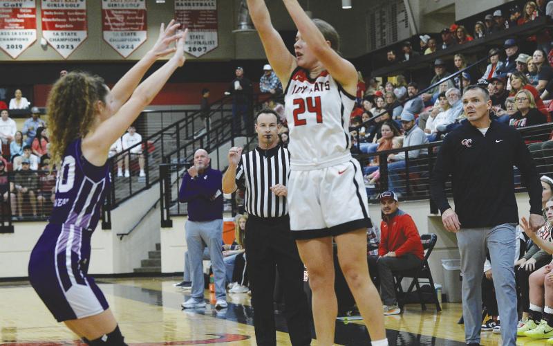 All eyes were on Garden City Lady Bearkat Brylon Frerich as she launches a 3-pointer during the Lady Kats district victory over Irion County on Tuesday.