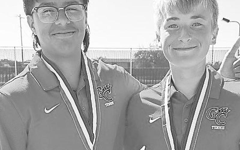 Garden City competed in the District 11-A Tennis Meet this week. The Bearkats on the District Team Title. LEFT: Jesus Fernandez and Weston Jost finished third in the boys doubles division. Below: Lacy Seidenberger and Presley Jost took second place in the Mixed Doubles Division and qualified for Regionals.