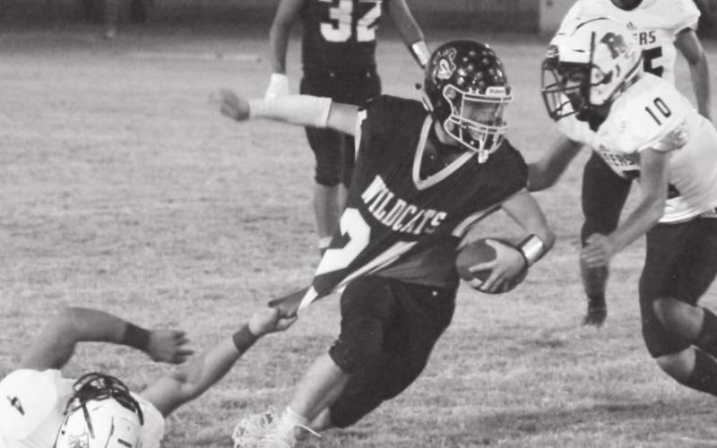 Grady’s Caden Hayes (24) gets slowed by a downed Steer, only momentarily however as he rushed for 245 in Grady’s 62-14 homecoming victory.