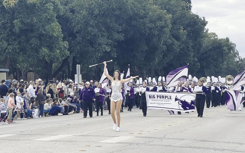 Grady High School graduate Briley Harrell leads the Abilene Christian University “Big Purple” band down the streets of Abilene on Oct. 19, during the ACU homecoming parade. Harrell is the feature twirler for the Wildcats this year. She twirls at each home game in the pre-game show, during Wildcat Walks, and during the halftime performance. She is the daughter of Trey and Sherra Harrell.