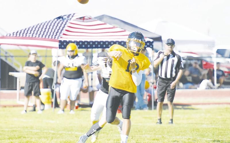Grady quarterback Marcus Brown drops a dime during the Wildcat’s scrimmage against Lorine last Friday in Grady.
