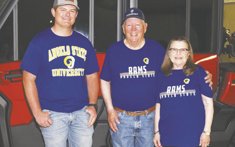 Garden City graduate Brody Hoelscher stands with Glasscock County 4-H shooting coach Fred Chaney and Chaney’s wife. The three sport Angelo State University shirts, where Hoelscher earned a scholarship last year to join the shotgun sports team. Hoelscher credits Chaney for helping him reach that goal.