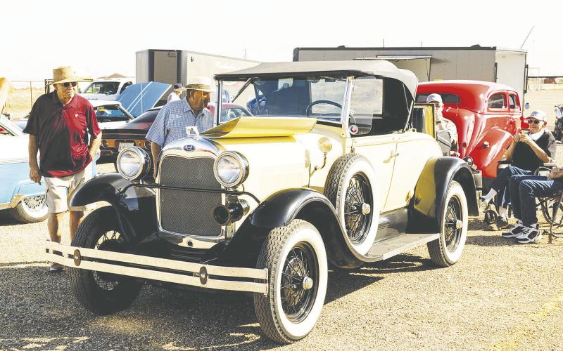 Folks admiring classic cars at a past Redneck Roundup Car &amp;amp; Truck Show in Stanton. The show returns Oct. 11 for its fifth year and is expected to bring in about 400 cars and trucks. Proceeds benefit Gifts of Hope, which supports cancer patients and their families across the Permian Basin.