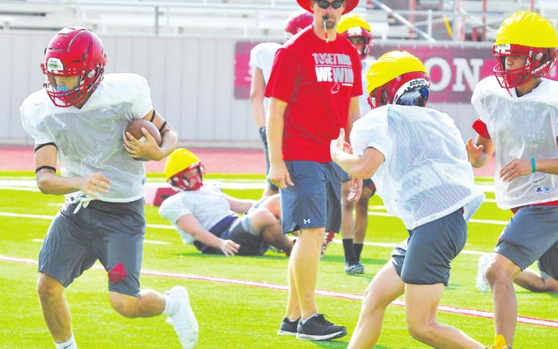 Stanton coach Cody Hogan watches his varsity offense and defense take reps during the first week of football practices. The Buffaloes are a young teams with only seven returning starters on offense and defense combined.