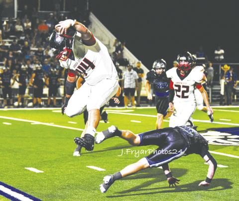 Garden City’s Roberto Almazan (44) hurdles a Westbrook Wildcat defender during one of the three receptions. photo by Janie Fryar