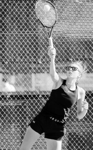 ABOVE: Samantha Griffin serves up a winner at South Plains College in Levelland during the Class A Region I Tennis Tournament.