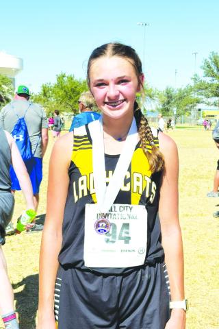 Madison leads Lady Cats at Tall City meet