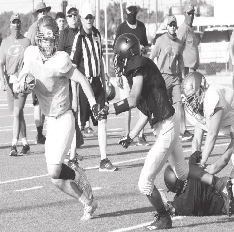 A huge pancake block helped Evan Cox avoid being tackled in the backfield.