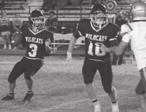 Grady quarterback Hunter McAnally looks for an open receiver while Gunner Cherry provides protection with some big blocks.