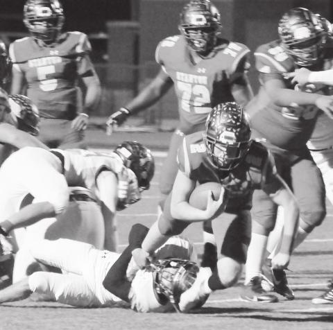 Evan Cox carries the ball for the Buffaloes offense during district action earlier this season.