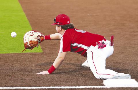 Stanton first baseman Kolton Bruner with the big stretch to get the out at first. photo provided by D’Lee Cook Photography